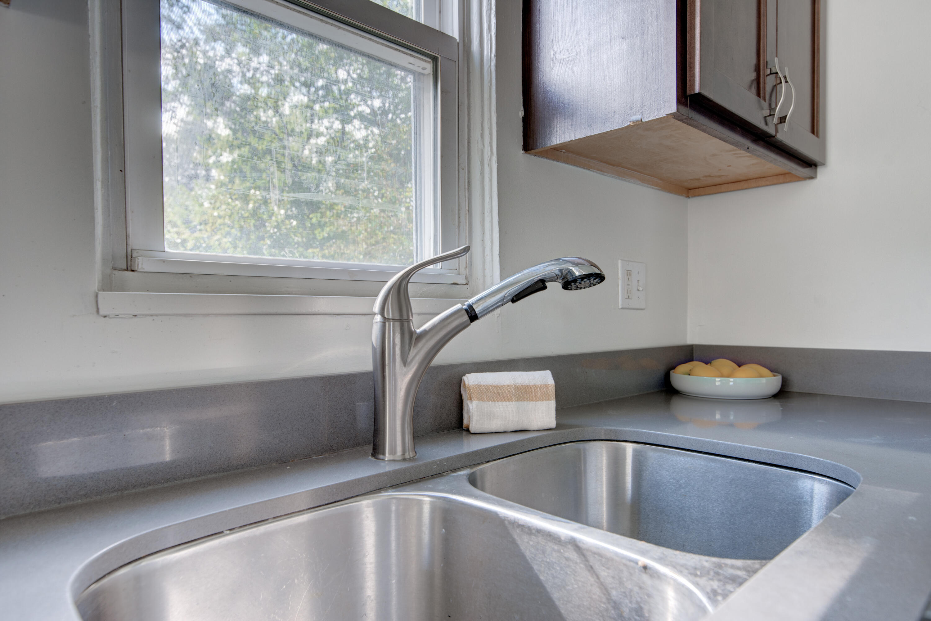 4409 East 11th Avenue Gary, IN 46403 - Photo 12 of 32 a kitchen with a sink and a window