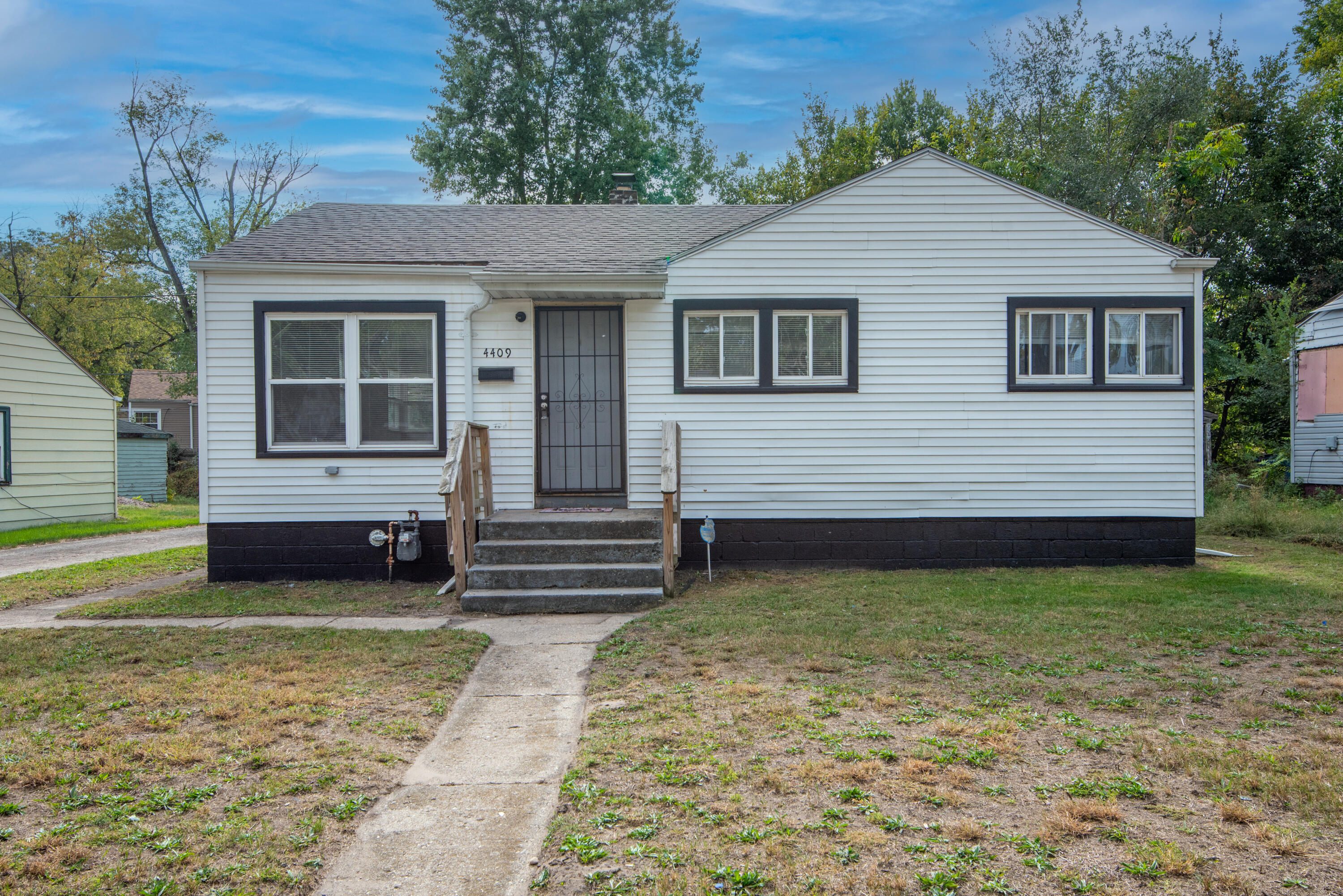 4409 East 11th Avenue Gary, IN 46403 - Photo 2 of 32 a view of a house with a yard