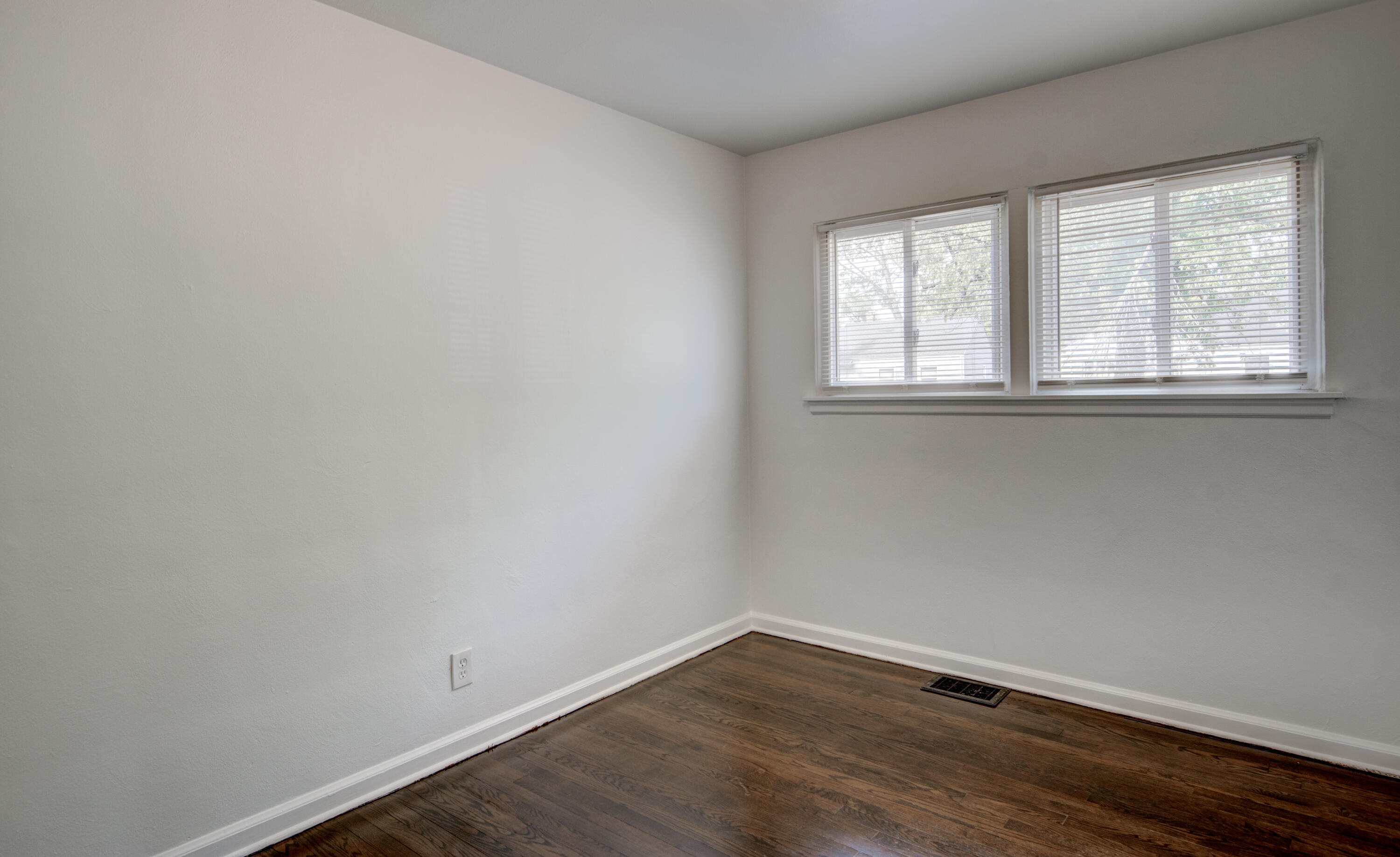 4409 East 11th Avenue Gary, IN 46403 - Photo 23 of 32 wooden floor in an empty room with a window