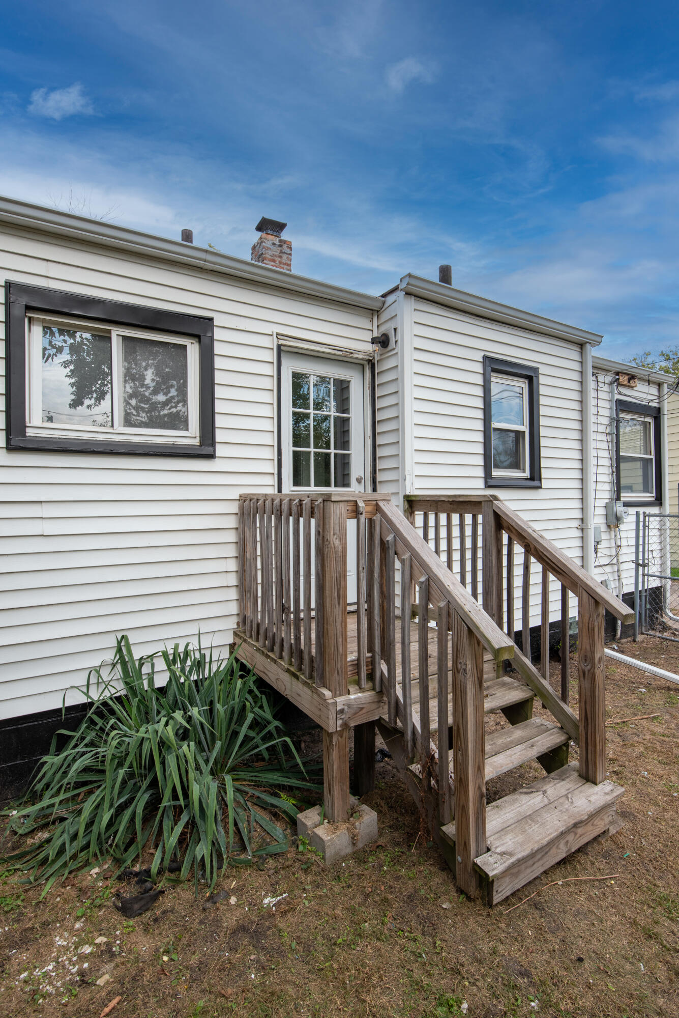 4409 East 11th Avenue Gary, IN 46403 - Photo 30 of 32 a view of a house with wooden deck front of house