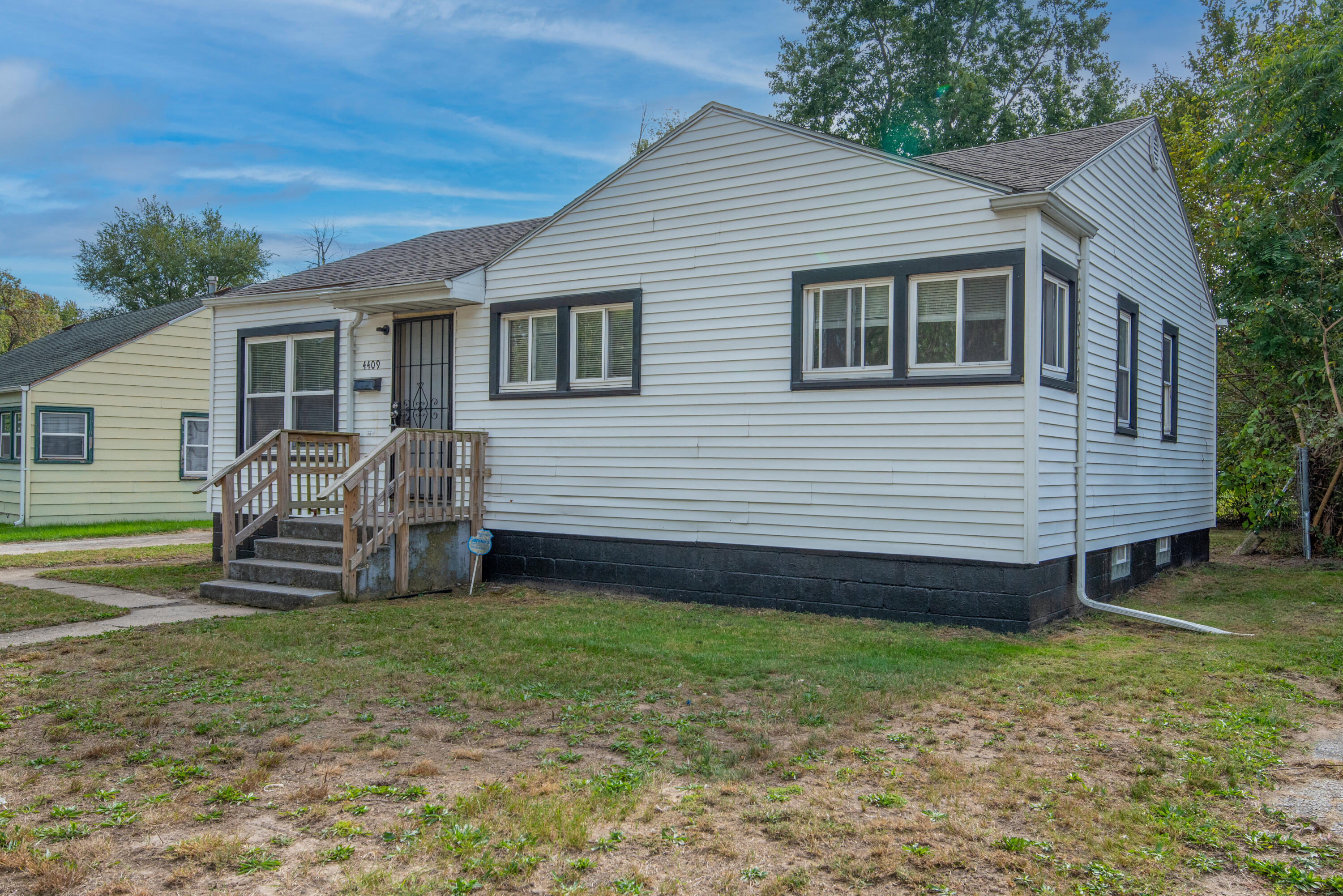 4409 East 11th Avenue Gary, IN 46403 - Photo 3 of 32 a view of a house with a yard and furniture
