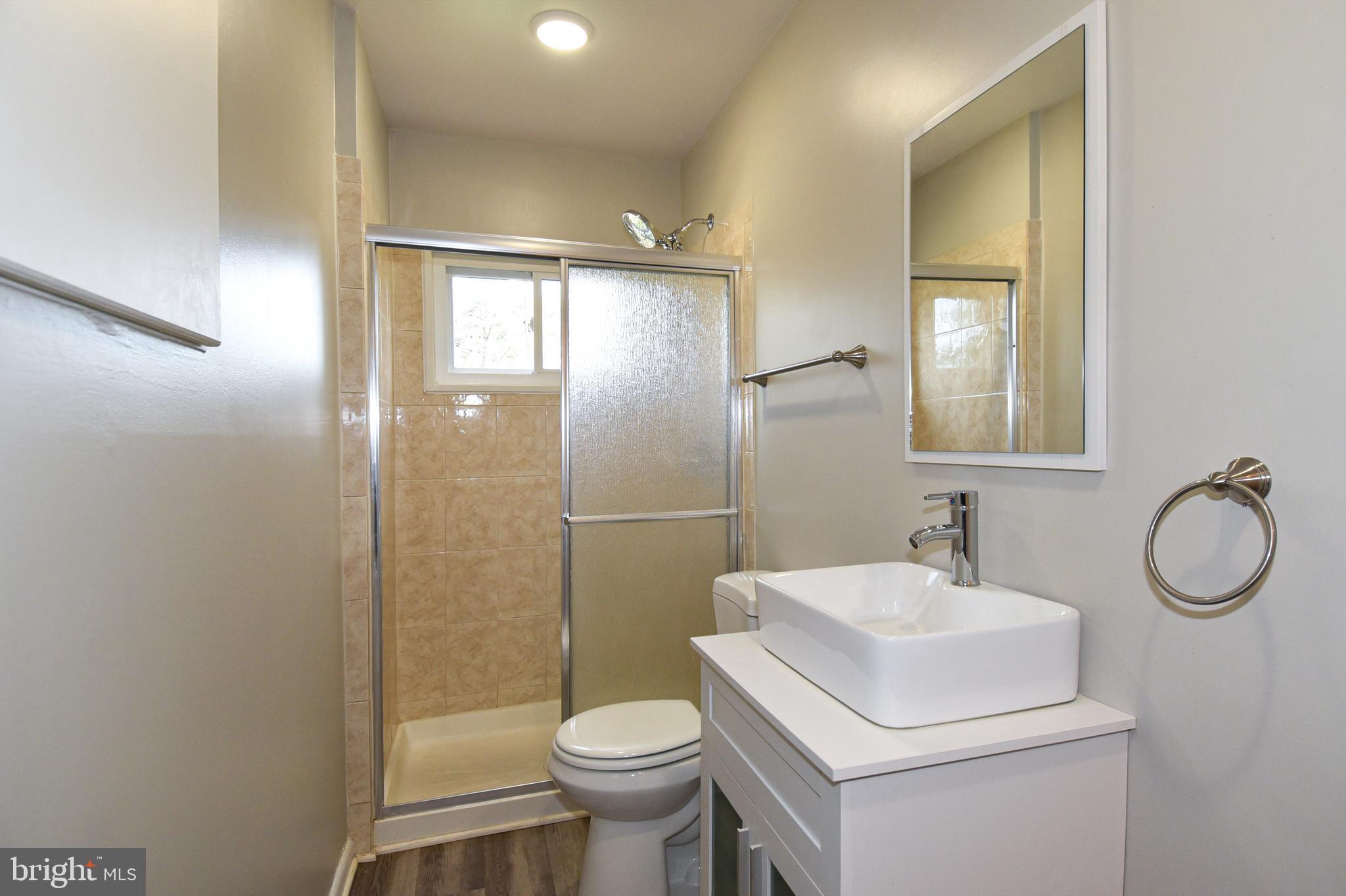 6319 Tone Court Bethesda, MD 20817 - Photo 17 of 29 a bathroom with a sink toilet and shower