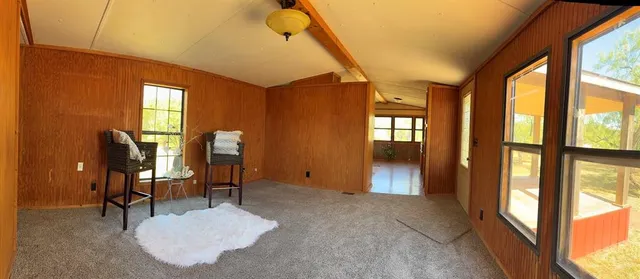 a view of a livingroom with furniture and windows