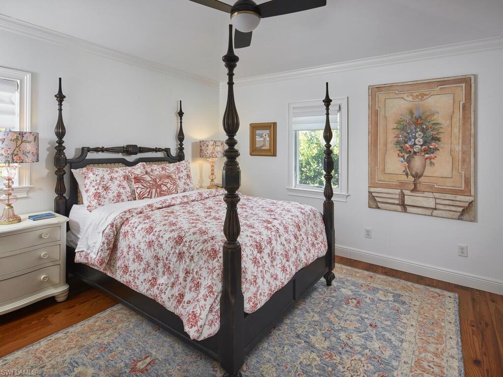 165 Broad Avenue South Naples, FL 34102 - Photo 14 of 18 a bedroom with a large bed and a window