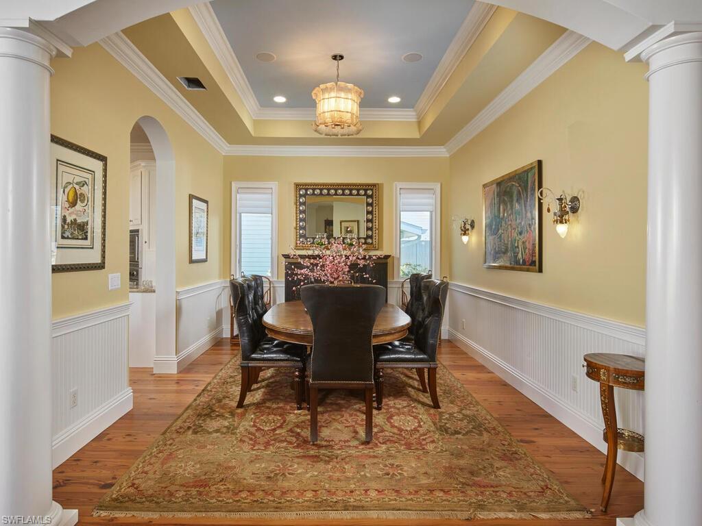 165 Broad Avenue South Naples, FL 34102 - Photo 7 of 18 a view of a dining room with furniture
