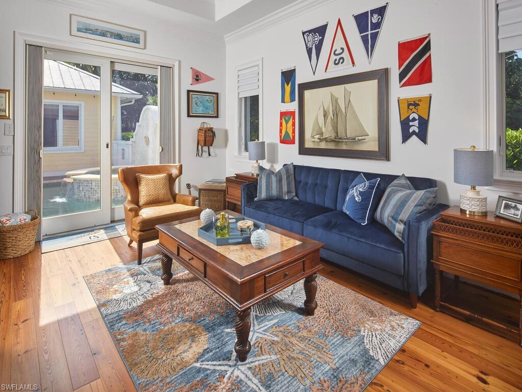 165 Broad Avenue South Naples, FL 34102 - Photo 8 of 18 a living room with furniture and a rug