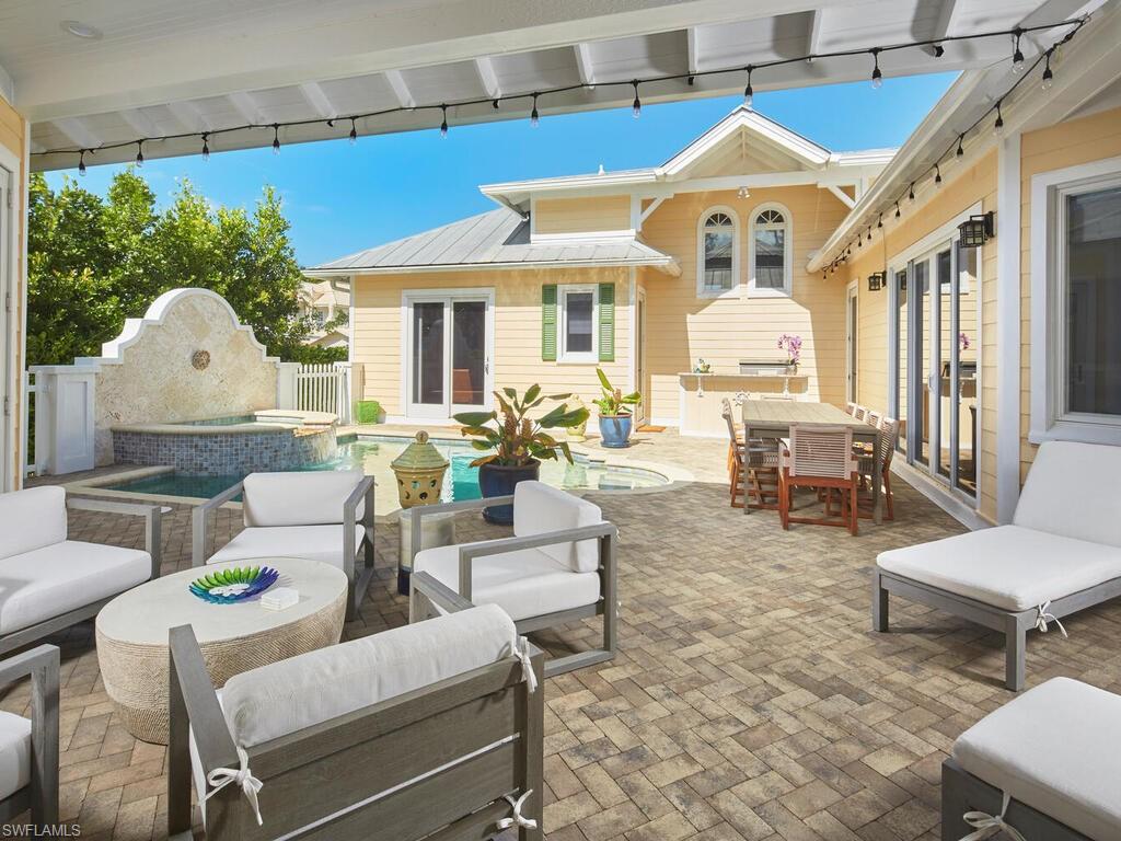 165 Broad Avenue South Naples, FL 34102 - Photo 10 of 18 a living room with furniture and a large window