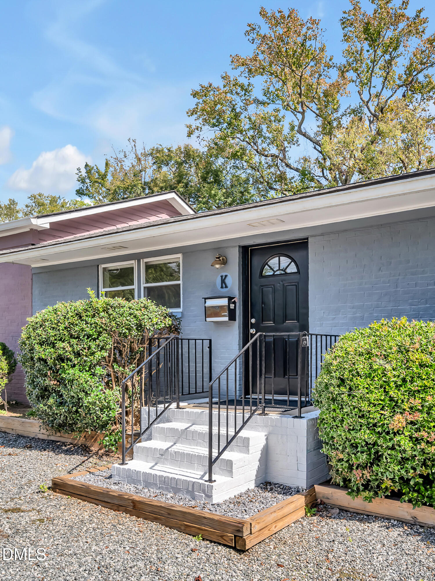 103 Hargraves Street, Unit K Carrboro, NC 27510 - Photo 1 of 19 a front view of a house with garden
