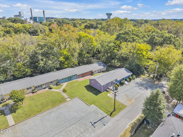 a view of a swimming pool with a yard