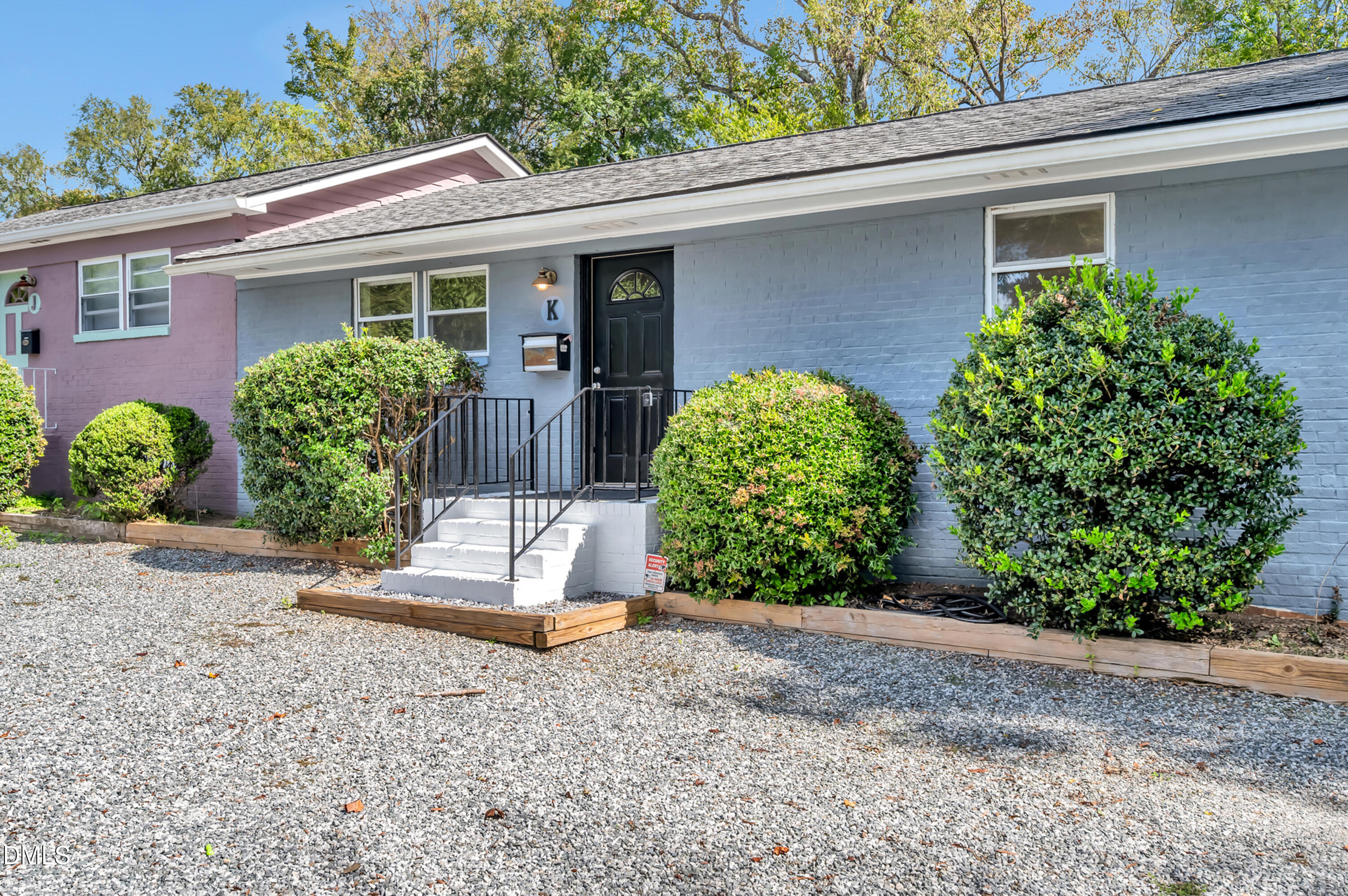 103 Hargraves Street, Unit K Carrboro, NC 27510 - Photo 2 of 19 a front view of a house with garden