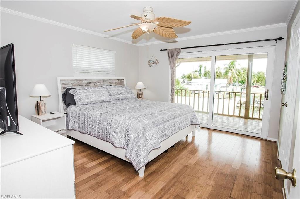 604 Sunset Court Goodland, FL 34140 - Photo 7 of 14 a bedroom with a bed and a large window