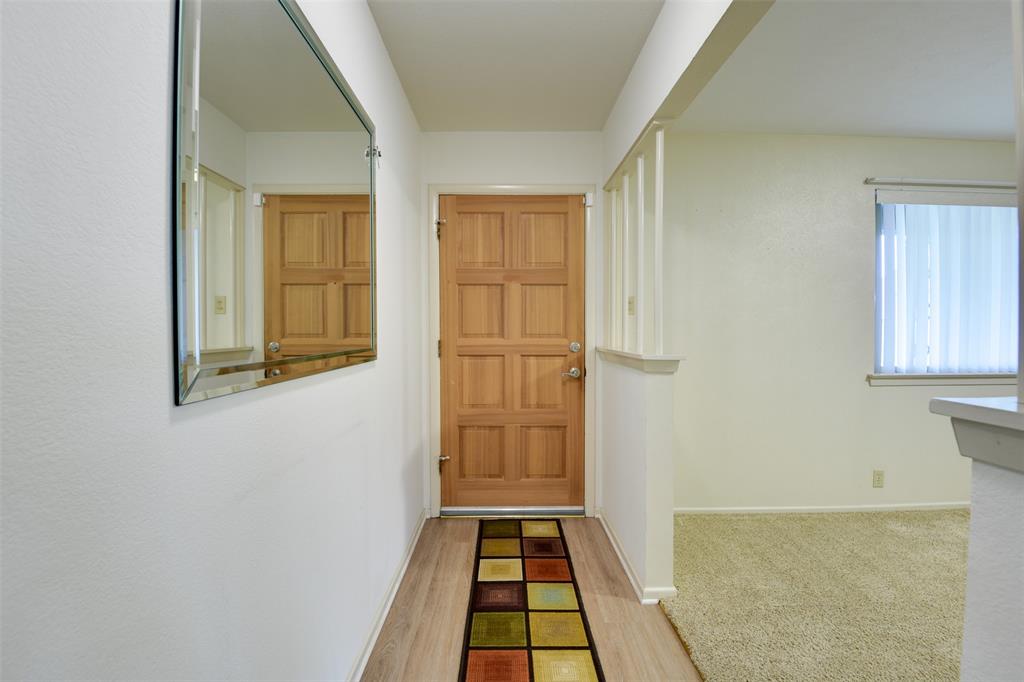 802 Cardinal Road Mansfield, TX 76063 - Photo 9 of 31 Entryway featuring baseboards and wood finished floors