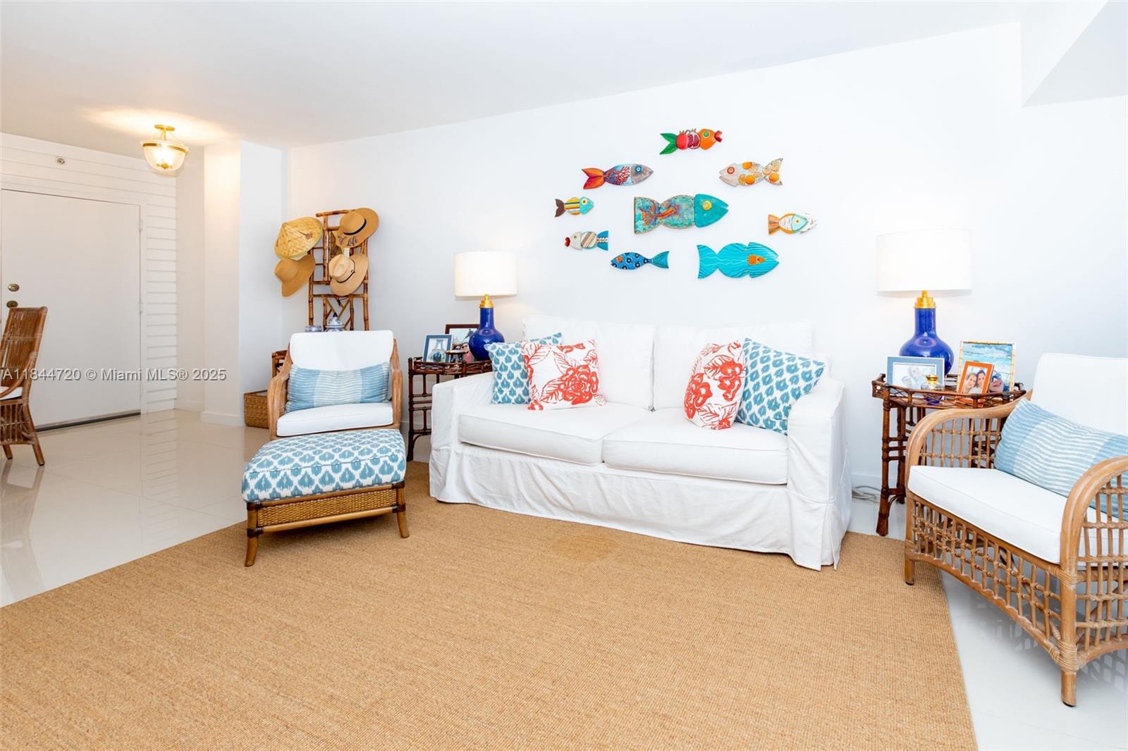 77 Crandon Boulevard, Unit 5B Key Biscayne, FL 33149 - Photo 14 of 41 a living room with furniture and a couch