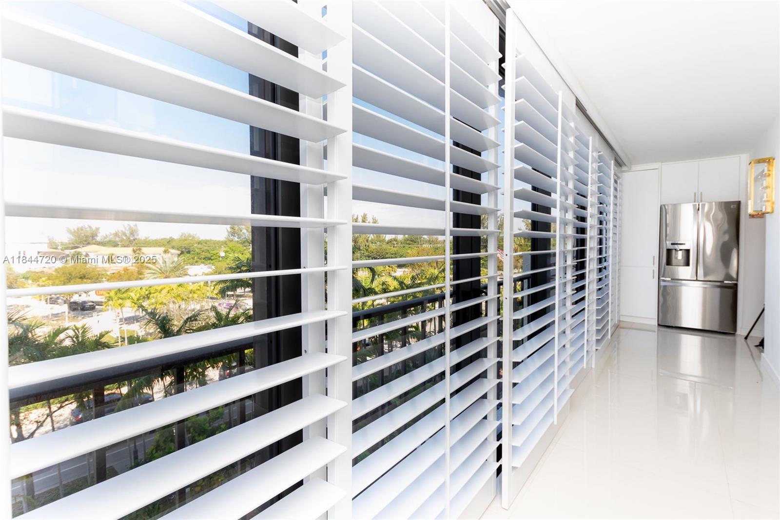 77 Crandon Boulevard, Unit 5B Key Biscayne, FL 33149 - Photo 18 of 41 a view of walk in closet with empty racks