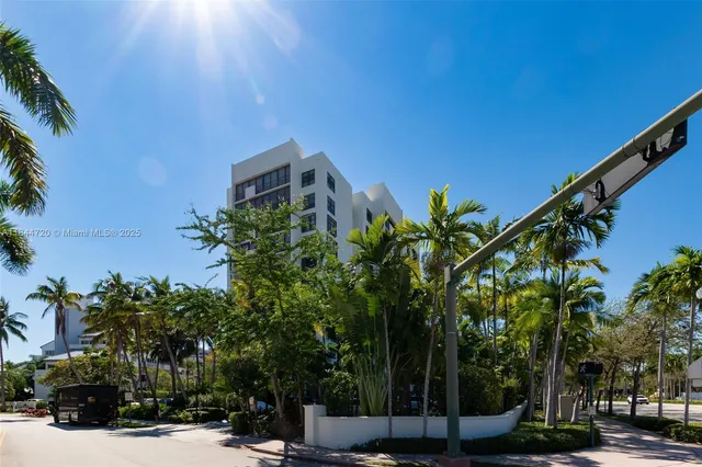 a view of a street with a building in the background