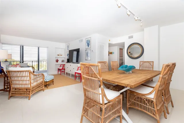 a dining room with a table and chairs