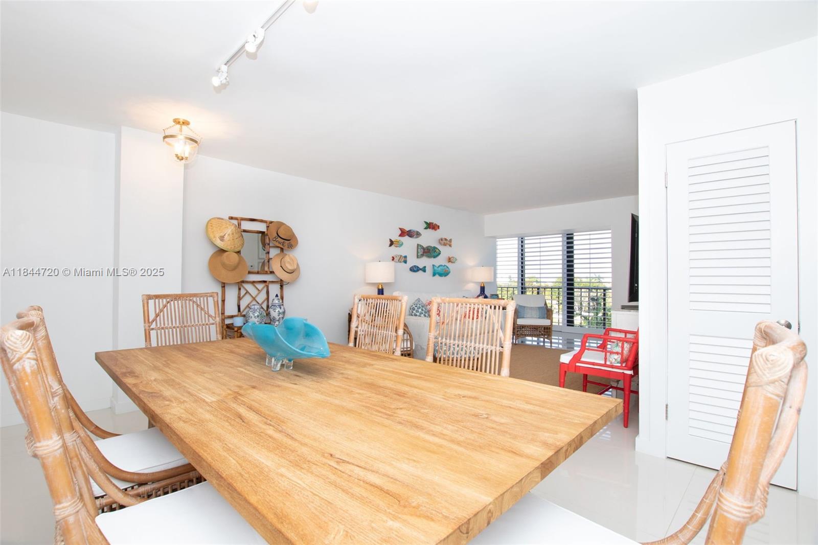 77 Crandon Boulevard, Unit 5B Key Biscayne, FL 33149 - Photo 9 of 41 a bed room with a bed and a table