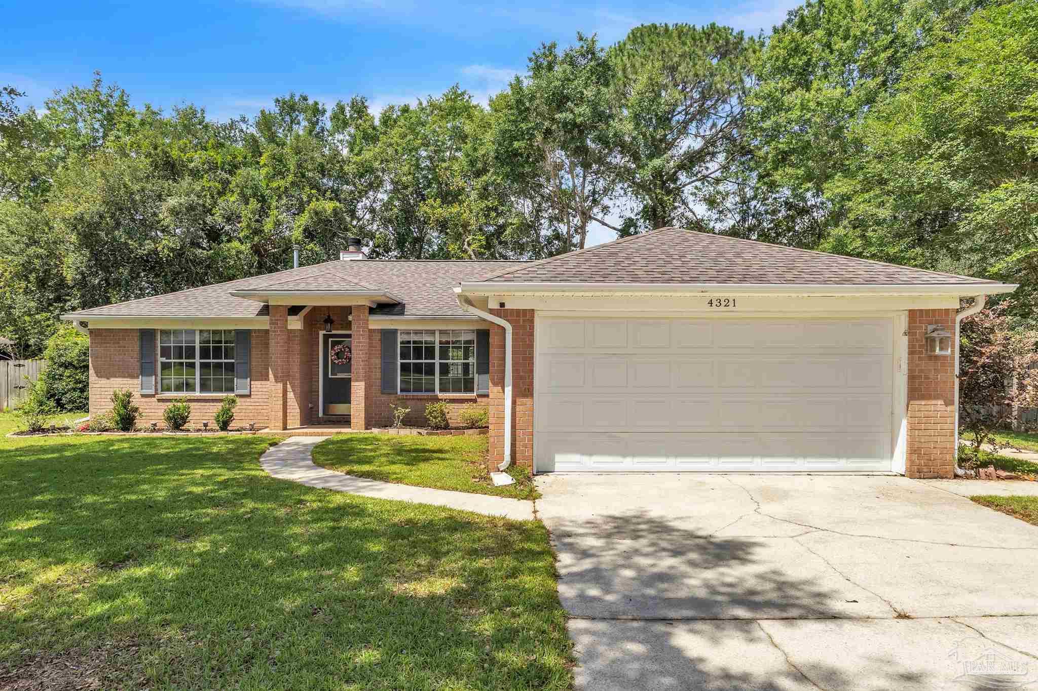 4321 Ridgeland Drive Pace, FL 32571 - Photo 29 of 36 a front view of a house with a yard