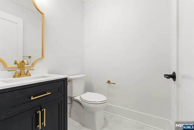 a view of an empty room with a window and fireplace