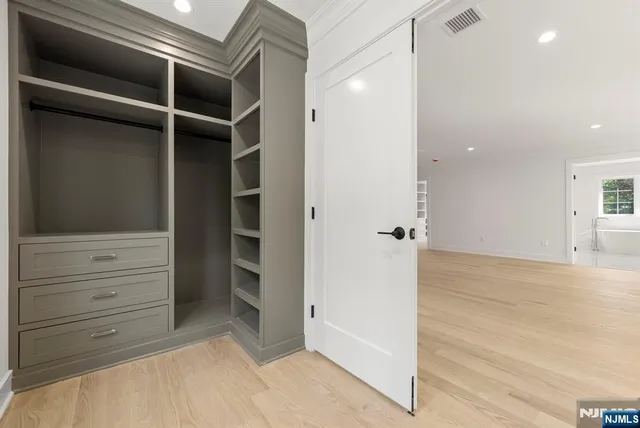 a view of a kitchen with sink a dishwasher and a refrigerator