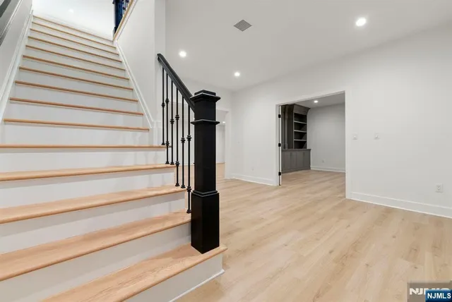 an aerial view of a house with swimming pool and garden