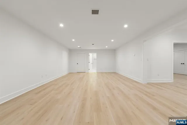 a view of a swimming pool with an outdoor seating and a yard