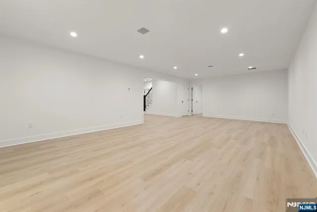 a view of a house with pool and chairs