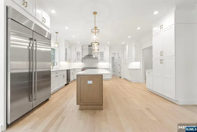 a white stove top oven sitting inside of a kitchen