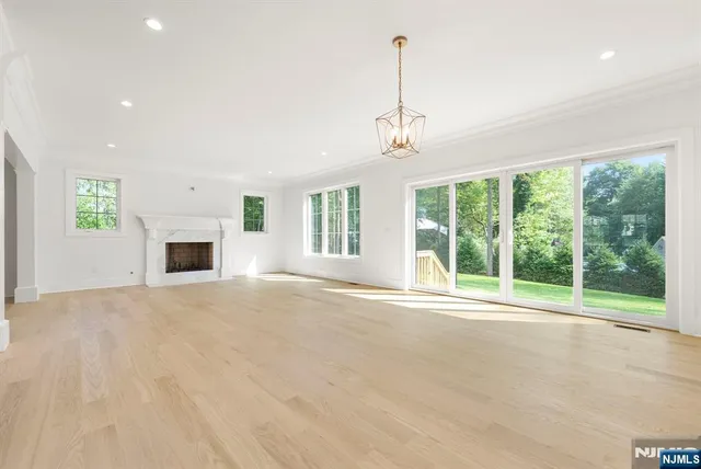 a view of a livingroom with furniture and a large window