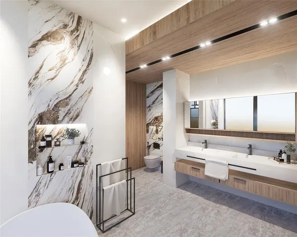 a bathroom with a sink mirror and a toilet