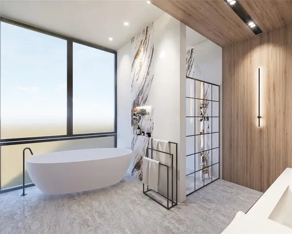 a spacious bathroom with a bathtub and shower