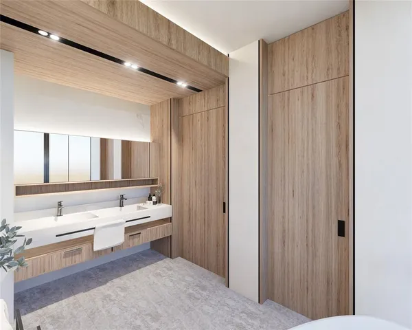 a bathroom with a double vanity sink a mirror and a bathtub