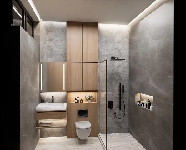 a bathroom with a granite countertop sink a toilet and shower