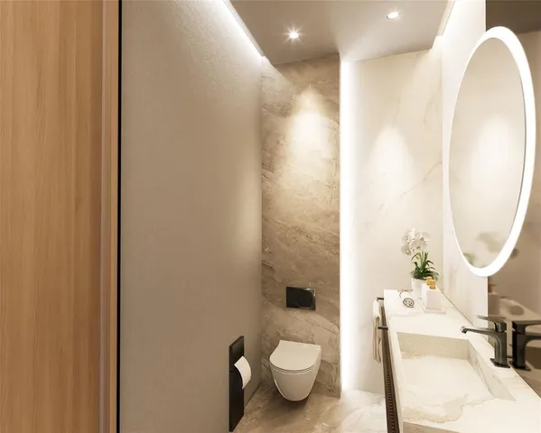 a bathroom with a sink a toilet and a mirror