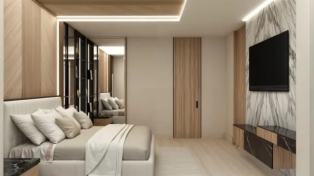 a bedroom with a bed and a flat tv screen