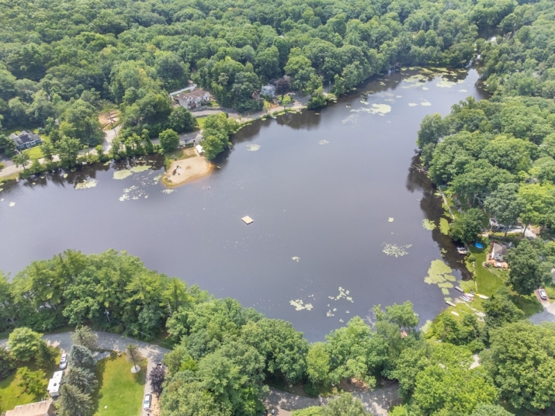 0 Clinton Road West Milford, NJ 07480 - Photo 2 of 4 an aerial view of a houses with a yard and lake view