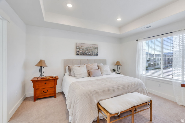 2664 West Maple Street Mapleton, UT 84664 - Photo 22 of 49 Recessed lighting illuminates a tray ceiling above neutral-toned carpeting