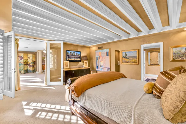 a bathroom with a granite countertop sink a mirror a bathtub and shower