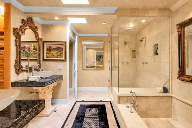 a bathroom with a tub sink and mirror
