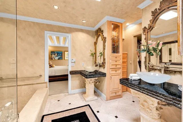a living room with furniture a window and a chandelier
