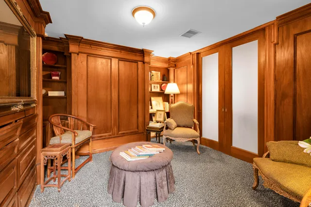 a front view of a house having outdoor seating