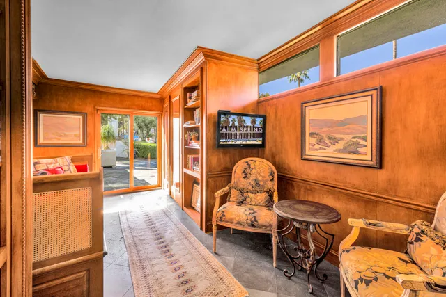 a terrace with outdoor seating and trees
