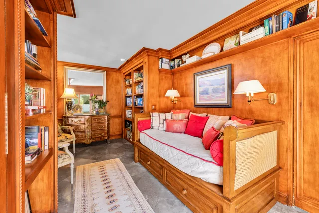 a view of a patio with chair and potted plants