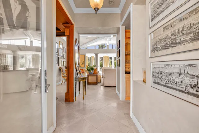 a living room with fireplace furniture and a large window