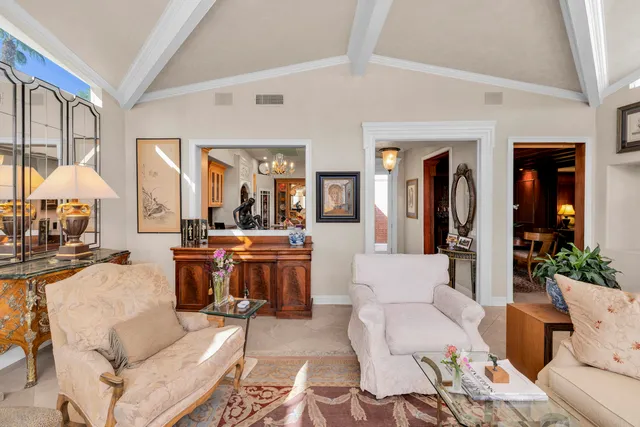 a view of a hallway with living room and furniture