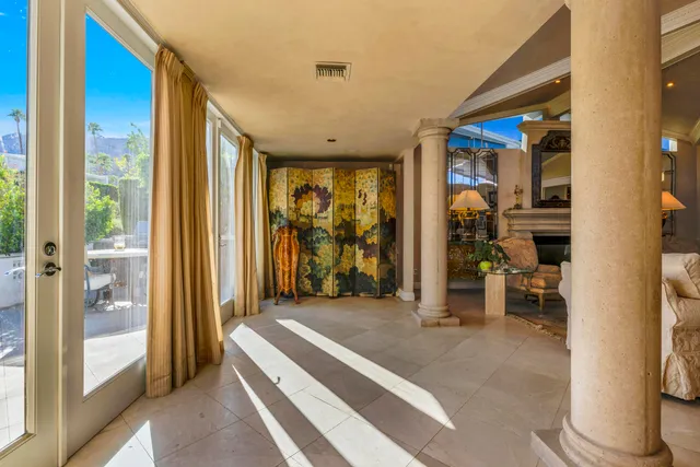 a large kitchen with stainless steel appliances a stove a sink and cabinets