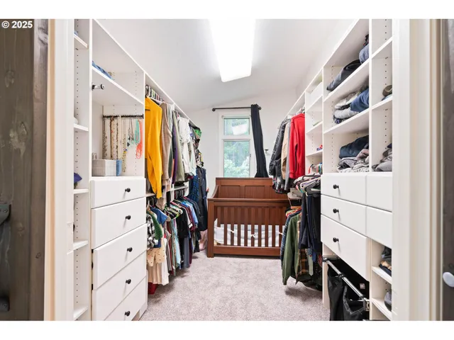 a bathroom with a granite countertop sink mirror and window
