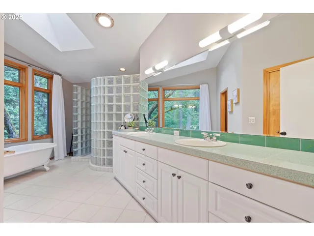 a bathroom with a sink a mirror and a vanity
