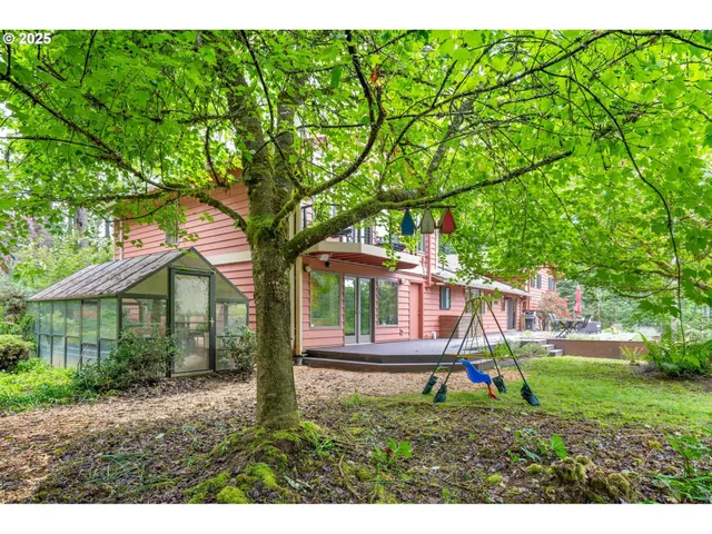 a view of a chairs and table on the wooden deck