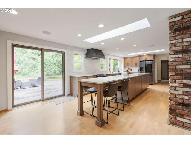a kitchen with a table and chairs